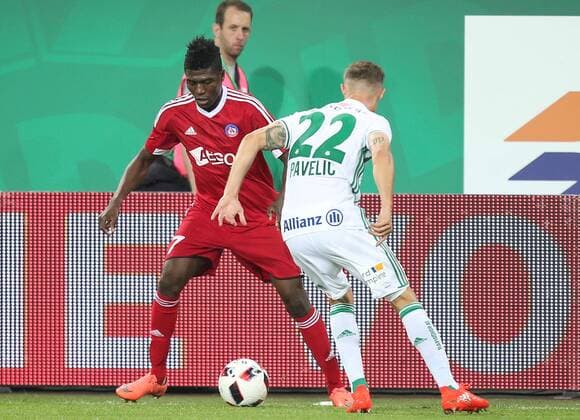SOCCER - UEFA EL quali, Rapid vs Trencin VIENNA,AUSTRIA,25.AUG.16 - SOCCER - UEFA Europa League, Play-off qualification, SK Rapid Wien vs FK AS Trencin. Image shows Aliko Bala (Trencin) and Mario Pavelic (Rapid). Keywords: Wien Energie. GEPAxpictures xPatrickxLeuk