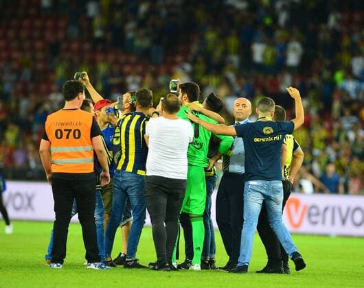 UEFA Europa league Playoff second leg match between Grasshoppers and Fenerbahce at Letzigrund Stadium in Zurich, Swiss on August 25 , 2016. Final Score: Grasshoppers 0 - Fenerbahce 2 Pictured:At the end of the game , Fenerbahce fans entered to the pitch in order to get a shirt of footballers of their teams. ( Goalkeeper Volkan Demirel ) Not available for publication in Turkey. 