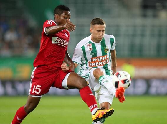 SOCCER - UEFA EL quali, Rapid vs Trencin VIENNA,AUSTRIA,25.AUG.16 - SOCCER - UEFA Europa League, Play-off qualification, SK Rapid Wien vs FK AS Trencin. Image shows Kingsley Madu (Trencin) and Arnor Ingvi Traustason (Rapid). Keywords: Wien Energie. GEPAxpictures xPatrickxLeuk