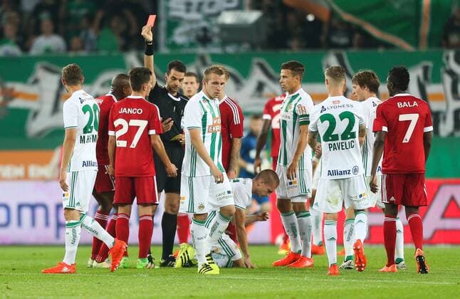 SOCCER - UEFA EL quali, Rapid vs Trencin VIENNA,AUSTRIA,25.AUG.16 - SOCCER - UEFA Europa League, Play-off qualification, SK Rapid Wien vs FK AS Trencin. Image shows players of Trencin and Rapid with referee Aleksandar Stavrev (MKD). Keywords: Wien Energie. GEPAxpictures xPhilippxBrem