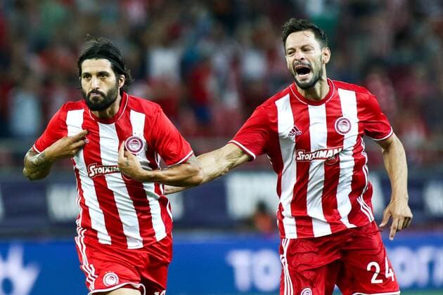 August 25, 2016 - Piraeus, Greece - Olympiaco s Argentinian midfielder Chori Dominguez (L) celebrates after scoring a goal with Olympiaco s Spanish defender Alberto de la Bella (R) during UEFA Europa League match between FC Olympiacos and FC Arouca at Georgios Karaiskakis Stadium in Piraeus on August 25, 2016. FC Olympiacos v FC Arouca - UEFA Europa League  - ZUMAn230