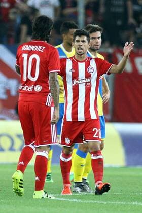 August 25, 2016 - Piraeus, Greece - Olympiaco s Argentinian midfielder Chori Dominguez (L) celebrates after scoring a goal with Olympiaco s Portuguese midfielder Andre Martins (R) during UEFA Europa League match between FC Olympiacos and FC Arouca at Georgios Karaiskakis Stadium in Piraeus on August 25, 2016. FC Olympiacos v FC Arouca - UEFA Europa League  - ZUMAn230