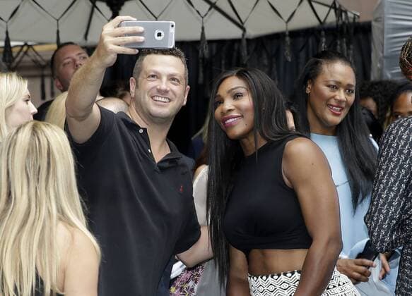 Serena WILLIAMS takes a selfie with fan when Serena Williams, Venus Williams and Rafael Nadal participate in a Virtual Tennis Tournament at Lotte New York Palace on August 25, 2016 in New York City. The US Open Tennis Championships begin on Monday.  NYP20160825106 JOHNxANGELILLO