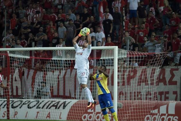 Greece: UEFA Europa League First playoff round, Game 2 Stefano Kapino (no 27) goalkeeper of Olympiacos catch the ball in front of Marlon de Jesus (no 9) of Arouca Final score, Olympiacos got 2 points while the Arouca got 1 point.  DimitriosxKarvountzisx xPacificxPress