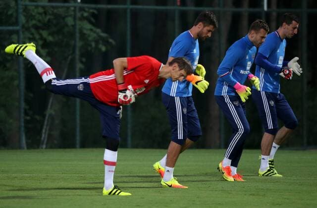 BELEK, TURKEY - AUGUST 30, 2016: The Russian men s national football team coach Gintaras Stauce, the Russian men s national football team goalkeepers Stanislav Kritsyuk, Igor Akinfeev, Soslan Dzhanayev (L-R) during a training session at a stadium of Maxx Royal Belek Golf Resort hotel ahead of a friendly match against Turkey. Alexander Demianchuk TASS  TS02F393