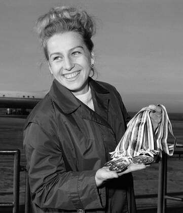 File Picture: Multiple (seven) Olympic gold medal winner (Tokyo 1964 and Mexico City 1968) Vera Caslavska, the world s only gymnast with the most Olympic gold medals shows her gold medals upon her arrival from Tokyo Olympic Games, Prague, Czechoslovakia, November 19, 1964. (CTKxPhotox xJirixFinda) CTKPhotoF200801020018601 