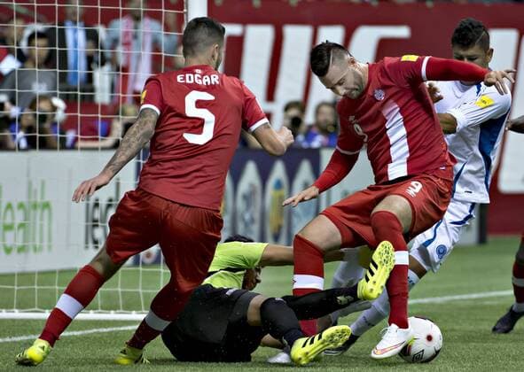 VANCOUVER, Sept. 6, 2016 -- Oscar Daniel Arroyo Pena (Bottom), goalkeeper of El Salvador, saves a goal from David Edgar (1st, L) and Marcus Haber (2nd, R) of Canada during their World Cup 2018 football qualification match in Vancouver on Sept. 6, 2016. Canada won 3-1. ) (SP)CANADA-VANCOUVER-WORLD CUP-QUALIFICATION-CONCACAF AndrewxSoong 