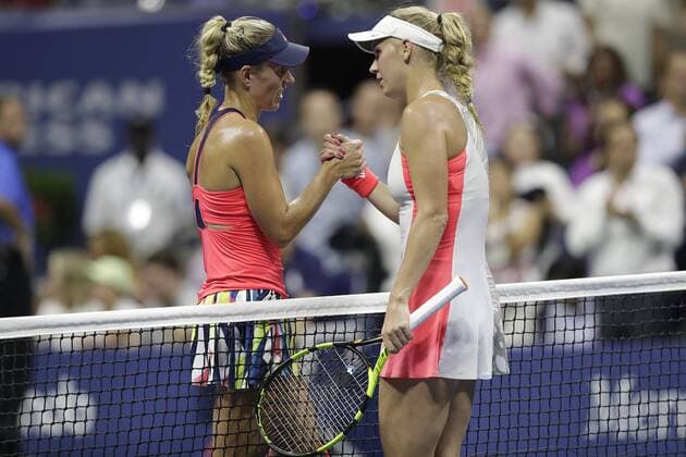 Angelique Kerber of Germany and Caroline Wozniacki shake hands at net after their semifinal match in Arthur Ashe Stadium at the 2016 US Open Tennis Championships at the USTA Billie Jean King National Tennis Center in New York City on September 8, 2016. Gerber defeated Wozniacki and with the victory becomes 1 in the world.  NYP20160908127 JOHNxANGELILLO