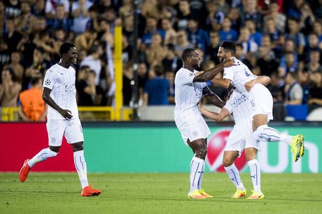 Leicester s Riyad Mahrez (R) celebrates with his teammates after scoring during a game of the first day of the group stage of the UEFA Champions League competition between Belgian first division soccer team Club Brugge KV and English club Leicester City F.C. in the group G in Brugge, Wednesday 14 September 2016. JASPERxJACOBS  x04931781x