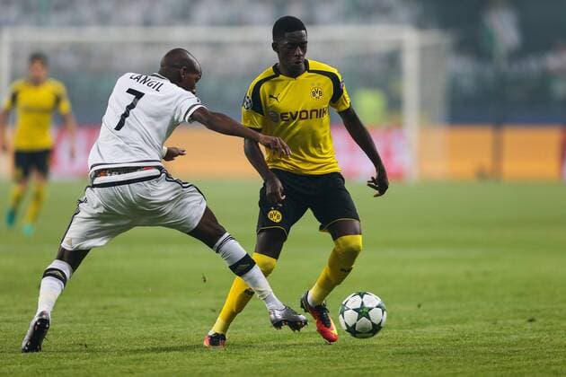 14.09.2016. Warsaw, Poland, UEFA Champions League football. Legia Warsaw versus Borrusia Dortmund. Ousmane Dembele (Borussia) takes on Steeven Langil (Legia) xTomaszxJastrzebowskix  ActionPlus11789444