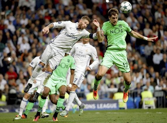 Real Madrid s Spanish defense Sergio Ramos (L) goes for a header aganist Sporting Portugal s Uruguayan defense Sebastian Coates during their UEFA Champions League 1st journey match at Santiago Bernabeu Stadium in Madrid, Spain, 14 September 2016. REAL MADRID VS. SPORTING PORTUGAL !ACHTUNG: NUR REDAKTIONELLE NUTZUNG!  MAD001 20160914-636094887139892069
