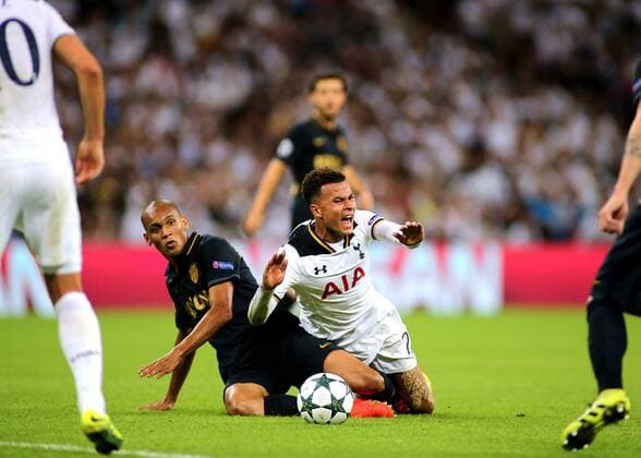 14.09.2016. Wembley Stadium, London, England. UEFA Champions League Football. Tottenham Hotspur versus Monaco. Tottenham Hotspur Midfielder Dele Alli is brought down in the eighteen yard area by AS Monaco Defender Fabinho but Referee Gianluca Rocchi waves play on xMarkxKertonx  ActionPlus11789543