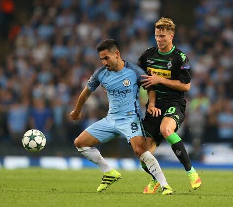 Ilkay Gundogan of Manchester City tussles with Nico Elvedi of Borussia Monchengladbach during the UEFA Champions League Group C match at The Etihad Stadium, Manchester. Picture date: September 14th, 2016. Pic Simon Bellis Sportimage EDITORIAL USE ONLY. No use with unauthorised audio, video, data, fixture lists, club league logos or live services. Online in-match use limited to 120 images, no video emulation. No use in betting, games or single club league player publications.