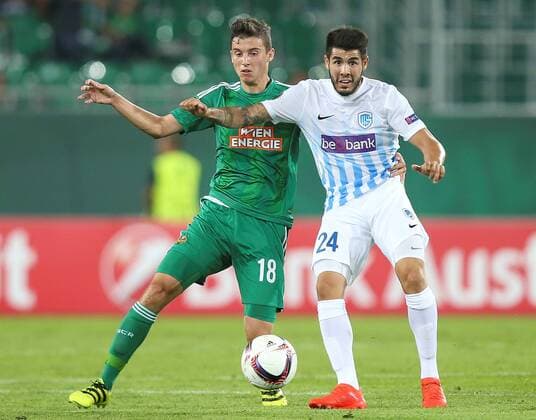 SOCCER - EL, Rapid vs Genk VIENNA,AUSTRIA,15.SEP.16 - SOCCER - UEFA Europa League, group stage, SK Rapid Wien vs KRC Genk. Image shows Tamas Szanto (Rapid) and Alejandro Pozuelo (Genk). Keywords: Wien Energie. GEPAxpictures xPatrickxLeuk
