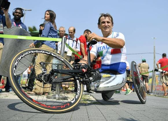 Former F1 driver Zanardi wins road hand-cycling gold Alessandro Zanardi of Italy celebrates after winning gold in the men s time trial H5 class of the cycling road event at the Rio de Janeiro Paralympics on Sept. 14, 2016. It was the third career Paralympic gold for Zanardi, a former Formula One driver who lost both legs in a crash during an auto race in September 2001. 