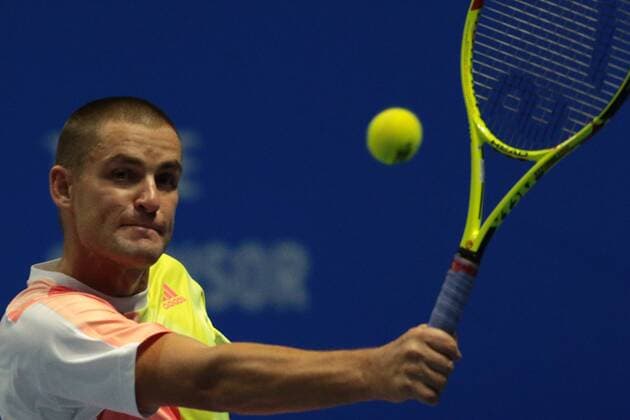 September 22, 2016 - Saint Petersburg, Russia - Mikhail Youzhny of Russia returns the ball to Milos Raonic of Canada during the St. Petersburg Open ATP Tennis Herren tennis tournament match in St. Petersburg, Russia, September 22, 2016. St. Petersburg Tennis Open 2016 - Mikhail Youzhny v Milos Raonic  - ZUMAn230