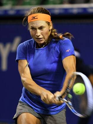 September 22, 2016, Tokyo, Japan - Yulia Putintseva of Kazakhstan returns the ball against Magda Linette of Poland during the second round of the Toray Pan Pacific Open tennis championships in Tokyo on Thursday, September 22, 2016. Noxthirdxpartyxsales  (lwxa004769)