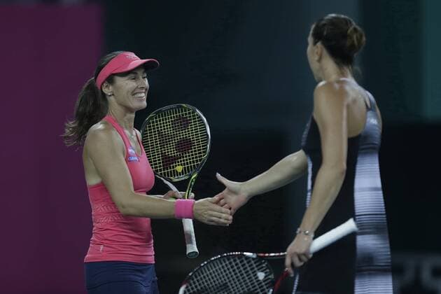 Martina Hingis of Switzerland, left, and Jelena Jankovic of Serbia shake hands to celebrate after they defeated Viktorija Golubic of Switzerland and Ipek Soylu of Turkey during their women s doubles quarterfinal match of the WTA Tennis Damen Guangzhou Open 2016 in Guangzhou city, south China s Guangdong province, 22 September 2016. Martina Hingis Jelena Jankovic defeated Viktorija Golubic Ipek Soylu 2:0 (6-0 6-1). Hingis Jankovic advance to semifinal at WTA Guangzhou Open  pbu507851_04