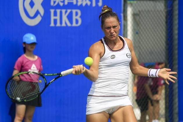 WUHAN, CHINA - SEPTEMBER 23: Kateryna Bondarenko of the Ukraine returns a shot against Tatjana Maria of Germany during the qualifying match of 2016 WTA Tennis Damen Dongfeng Motor Wuhan Open at Optics Valley International Tennis Center on September 23, 2016 in Wuhan, China.  CFP492556010 