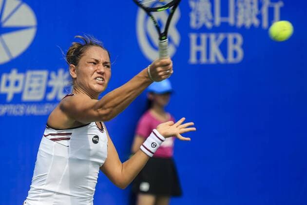 WUHAN, CHINA - SEPTEMBER 23: Kateryna Bondarenko of the Ukraine returns a shot against Tatjana Maria of Germany during the qualifying match of 2016 WTA Tennis Damen Dongfeng Motor Wuhan Open at Optics Valley International Tennis Center on September 23, 2016 in Wuhan, China.  CFP492556012 