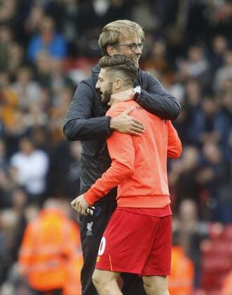 24.09.2016. Anfield, Liverpool, England. Premier League Football. Liverpool versus Hull City. Liverpool manager Jurgen Klopp hugs his midfielder Adam Lallana at the final whistle. xAlanxMartinx  ActionPlus11793013