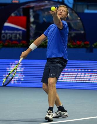 ST PETERSBURG, RUSSIA â€“ SEPTEMBER 25, 2016: Yevgeny Kafelnikov of Russia serves the ball in a mixed doubles match as part of the tennis legends show at the 2016 St. Petersburg Open. Andrei Ivanov TASS  TS032576