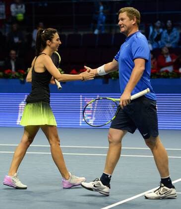ST PETERSBURG, RUSSIA â€“ SEPTEMBER 25, 2016: Anastasia Myskina (L) and Yevgeny Kafelnikov of Russia in a mixed doubles match as part of the world tennis legends show at the 2016 St. Petersburg Open. Andrei Ivanov TASS  TS03257D