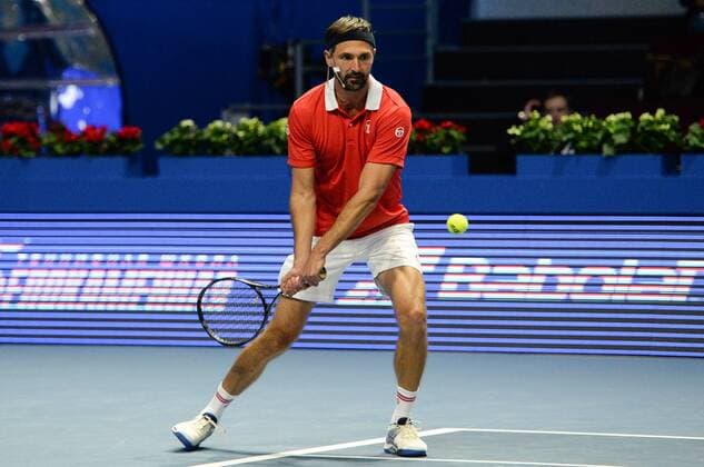 ST PETERSBURG, RUSSIA â€“ SEPTEMBER 25, 2016: Goran Ivanisevic of Croatia returns the ball in a mixed doubles match against Anastasia Myskina and Yevgeny Kafelnikov of Russia as part of the world tennis legends show at the 2016 St. Petersburg Open. Andrei Ivanov TASS  TS032580