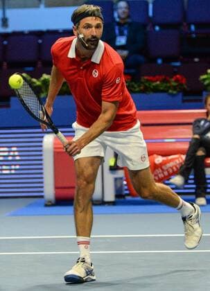 ST PETERSBURG, RUSSIA â€“ SEPTEMBER 25, 2016: Goran Ivanisevic of Croatia returns the ball in a mixed doubles match against Anastasia Myskina and Yevgeny Kafelnikov of Russia as part of the world tennis legends show at the 2016 St. Petersburg Open. Andrei Ivanov TASS  TS032581