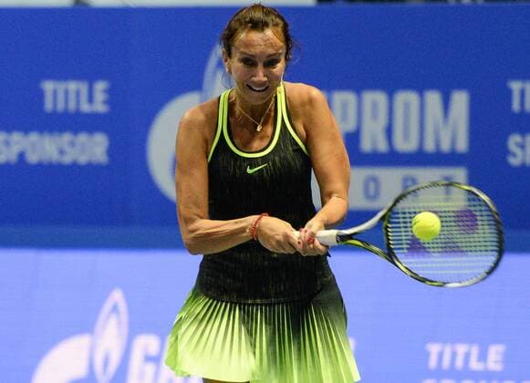 ST PETERSBURG, RUSSIA â€“ SEPTEMBER 25, 2016: Iva Majoli of Croatia returns the ball in a mixed doubles match against Anastasia Myskina and Yevgeny Kafelnikov of Russia as part of the world tennis legends show at the 2016 St. Petersburg Open. Andrei Ivanov TASS  TS032588