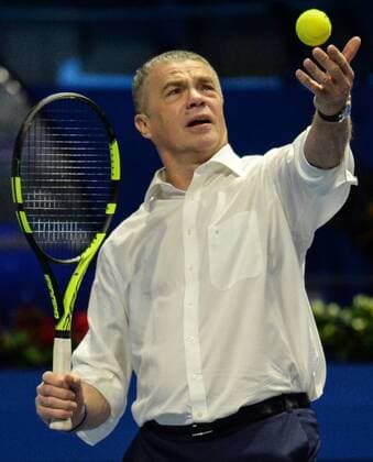ST PETERSBURG, RUSSIA â€“ SEPTEMBER 25, 2016: Deputy Chairman of the Management Committee of Gazprom Alexander Medvedev serbes the ball at the 2016 St. Petersburg Open. Andrei Ivanov TASS  TS032594