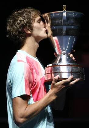 ST PETERSBURG, RUSSIA - SEPTEMBER 25, 2016: Alexander Zverev of Germany kisses his trophy during the award ceremony for the men s singles final at the 2016 St. Petersburg Open international tennis tournament. Peter Kovalev TASS  TS032696