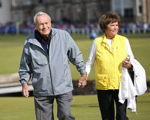 Arnold Palmer (L) seen with his wife Kathleen Gawthrop in this July 15, 2015 file photo from the the144th Open Championship at St.Andrews, died today, September 25, 2016, at 87 according to a USGA statement. The seven-time major winner was known as the king of golf and given credit for bringing the to the masses. File  WAX20160925302 KEVINxDIETSCH