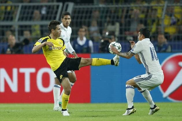 (L-R) Raphael Guerreiro of Borussia Dortmund, Raphael Varane of Real Madrid, James Rodriguez of Real Madrid during the UEFA Champions League group F match between Borussia Dortmund and Real Madrid on September 27, 2016 at the Signal Iduna Park stadium in Dortmund, Germany. Borussia Dortmund v Real Madrid UEFA Champions League 2016 2017 xVIxxIVx 6300623