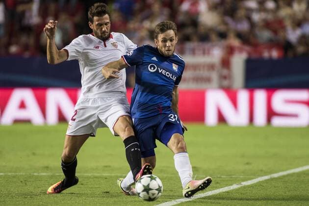 September 27, 2016 - Seville, Spain - Franco Vazquez of Sevilla (L ) fights for the ball with Maciej Rybus of Olympique Lyonnais (R ) during the UEFA Champions League Group H soccer match between Sevilla FC and Olympique Lyonnais at Estadio Ramon Sanchez Soccer 2016 - Sevilla FC vs Olympique Lyonnais - ZUMAa142