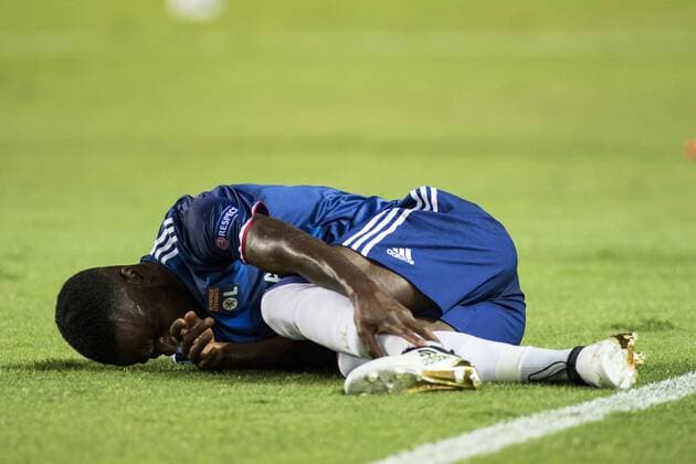 September 27, 2016 - Seville, Spain - Corentin Tolisso of Olympique Lyonnais lies injured during the UEFA Champions League Group H soccer match between Sevilla FC and Olympique Lyonnais at Estadio Ramon Sanchez Soccer 2016 - Sevilla FC vs Olympique Lyonnais - ZUMAa142