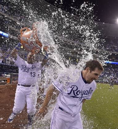 September 27, 2016 - Kansas City, MO, USA - The Kansas City Royals Billy Burns receives a victory shower from teammate Salvador Perez after Burns game-winning sacrifice fly to score Raul Mondesi for a 4-3 win in the 11th inning against the Minnesota Twins on Tuesday, Sept. 27, 2016, Kauffman Stadium in Kansas City, Mo. Minnesota at Kansas City - ZUMAm67_