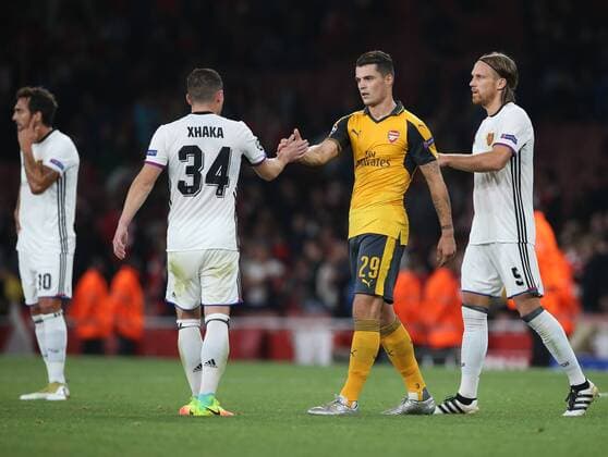 Arsenal s Granit Xhaka embraces brother Taulant Xhaka of Basel at the final whistle during the Champions League group A match at the Emirates Stadium, London. Picture date September 28th, 2016 Pic David Klein Sportimage EDITORIAL USE ONLY. No use with unauthorised audio, video, data, fixture lists, club league logos or live services. Online in-match use limited to 120 images, no video emulation. No use in betting, games or single club league player publications.