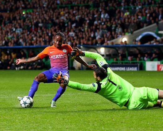 Raheem Sterling of Manchester City scores their second goal past Craig Gordon of Celtic during the Champions League Group C match at the Celtic Park Stadium, Glasgow. Picture date: September 28th, 2016. Pic Simon Bellis Sportimage EDITORIAL USE ONLY. No use with unauthorised audio, video, data, fixture lists, club league logos or live services. Online in-match use limited to 120 images, no video emulation. No use in betting, games or single club league player publications.
