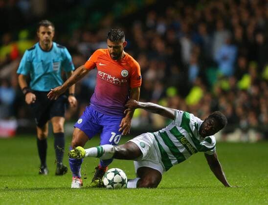 Sergio Aguero of Manchester City tackled by Kolo Toure of Celtic during the Champions League Group C match at the Celtic Park Stadium, Glasgow. Picture date: September 28th, 2016. Pic Simon Bellis Sportimage EDITORIAL USE ONLY. No use with unauthorised audio, video, data, fixture lists, club league logos or live services. Online in-match use limited to 120 images, no video emulation. No use in betting, games or single club league player publications.