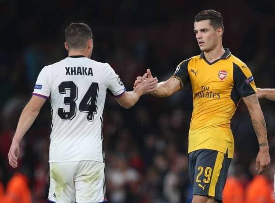 Arsenal s Granit Xhaka embraces brother Taulant Xhaka of Basel at the final whistle during the Champions League group A match at the Emirates Stadium, London. Picture date September 28th, 2016 Pic David Klein Sportimage EDITORIAL USE ONLY. No use with unauthorised audio, video, data, fixture lists, club league logos or live services. Online in-match use limited to 120 images, no video emulation. No use in betting, games or single club league player publications.