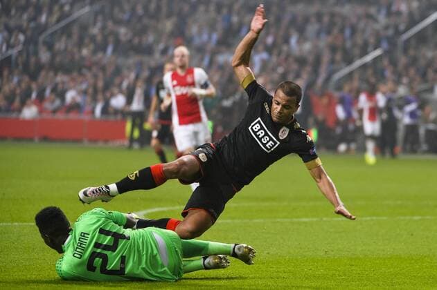 Ajax s goalkeeper Andre Onana and Standard s Matthieu Dossevi pictured in action during a game of the second day of the group stage of the Europa League competition between Dutch soccer team Ajax Amsterdam and Belgian club Standard de Liege, in Amsterdam, The Netherlands, Thursday 29 September 2016. NICOLASxLAMBERT  x04943793x