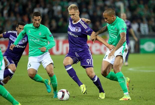 Saint-Etienne s Jeremy Clement, Anderlecht s Lukasz Teodorczyk and Saint-Etienne s Leo Lacroix fight for the ball during a game on the second day of the group stage (group C) of the UEFA Europa League competition between French club AS Saint-Etienne and Belgian soccer team RSC Anderlecht in Saint-Etienne, France, Thursday 29 September 2016. VIRGINIExLEFOUR  x04943898x