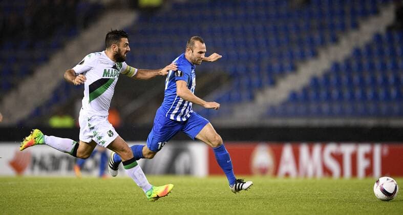 Sassuolo s Francesco Magnanelli and Genk s Thomas Buffel fight for the ball during a game on the second day of the group stage (group F) of the Europa League competition between Belgian soccer team KRC Genk and Italian club US Sassuolo Calcio in Genk, Thursday 29 September 2016. YORICKxJANSENS  x04943977x