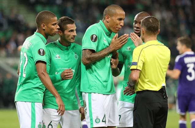Saint-Etienne s Leo Lacroix and referee Vladislav Bezborodov argue during a game on the second day of the group stage (group C) of the UEFA Europa League competition between French club AS Saint-Etienne and Belgian soccer team RSC Anderlecht in Saint-Etienne, France, Thursday 29 September 2016. VIRGINIExLEFOUR  x04944008x