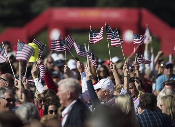 Fans wave American flags during the opening ceremony of the 2016 Ryder Cup at Hazeltine National Golf Club in Chaska, Minnesota on September 29, 2016.  MIN20160929325 KEVINxDIETSCH