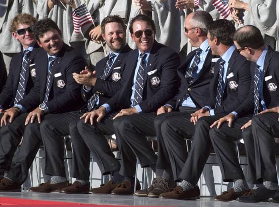 USA team member Phil Mickelson (C) sits with teammates during the opening ceremony of the 2016 Ryder Cup at Hazeltine National Golf Club in Chaska, Minnesota on September 29, 2016.  MIN20160929332 KEVINxDIETSCH