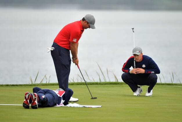 USA team member Jordan Spieth and Patrick Reed line up a putt on the 7th green on day 1 of the 2016 Ryder Cup at Hazeltine National Golf Club in Chaska, Minnesota on September 30, 2016.  MIN20160930339 KEVINxDIETSCH