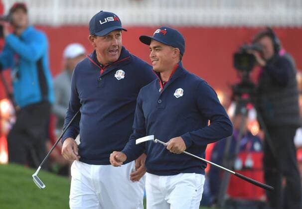 USA team member Phil Mickelson and Rickie Fowler walk off toggery on the 1st green day 2 of the 2016 Ryder Cup at Hazeltine National Golf Club in Chaska, Minnesota on October 1 2016.  MIN20161001309 KEVINxDIETSCH
