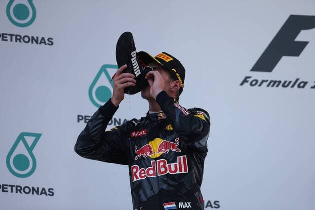 Malaysian Grand Prix, Sepang 29 September - 2 October 2016 02.10.2016 - Race, 2nd position Max Verstappen (NED) Red Bull Racing RB12 drinks champagne with the shoe with Daniel Ricciardo (AUS) Red Bull Racing RB12 